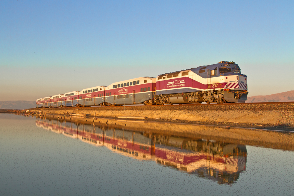 blue, white, and purple bi-level commuter train