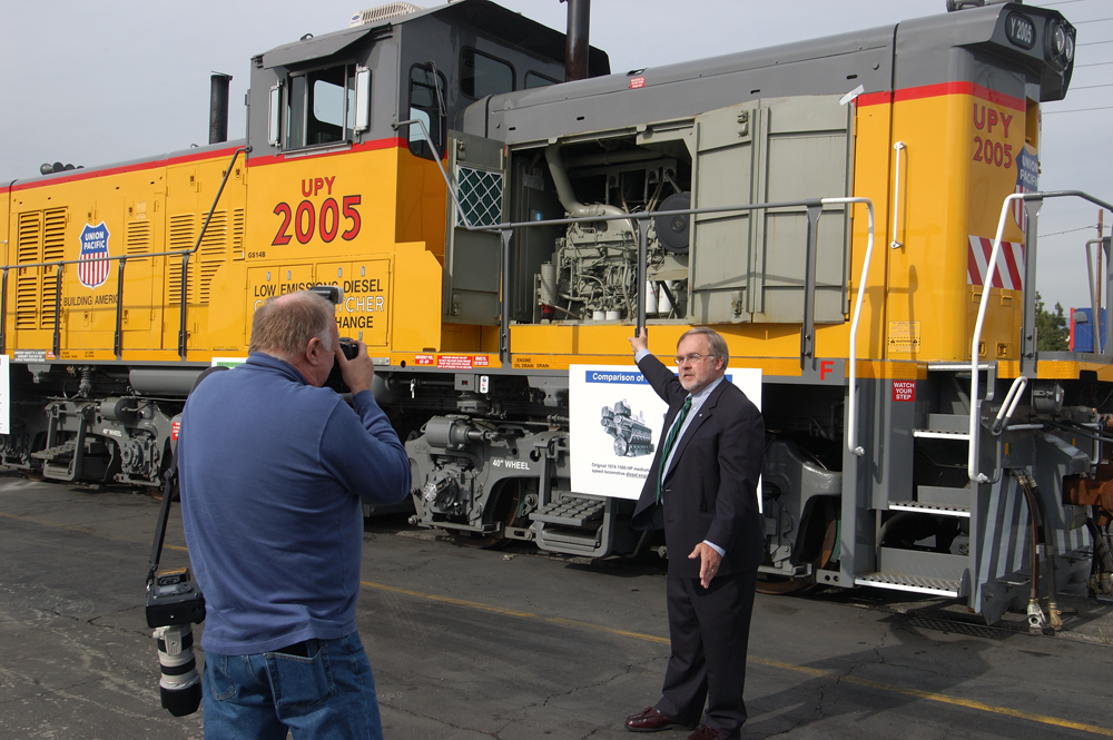 two men by yellow genset