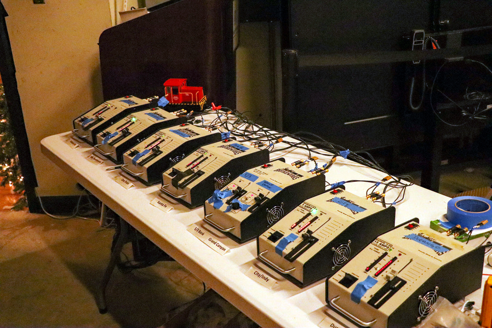 A folding table with seven transformers on top