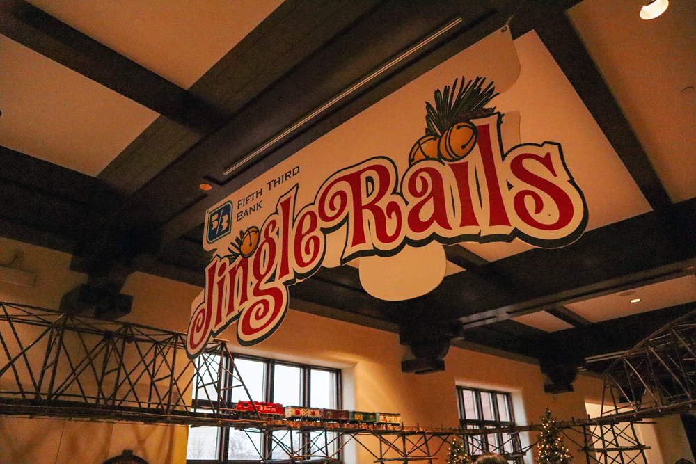 Sign hanging from the roof that says "Jingle Rails"