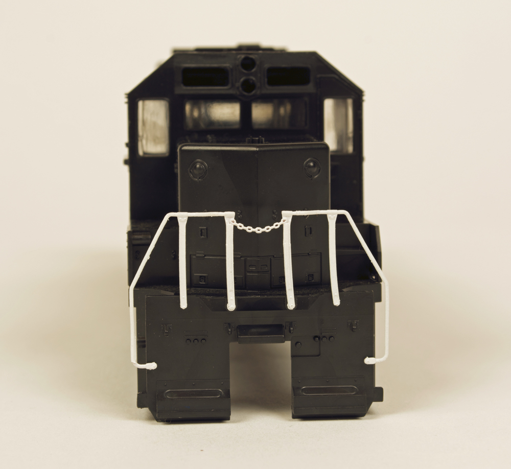 Photo showing white handrails and stanchions on undecorated model