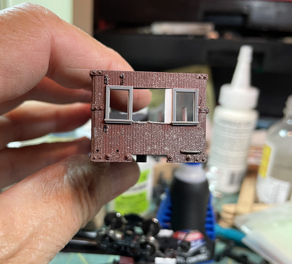 End of caboose model with large opening cut for grey windows with white spacers