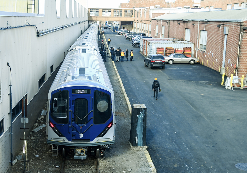 Subway cars parked on track in yard