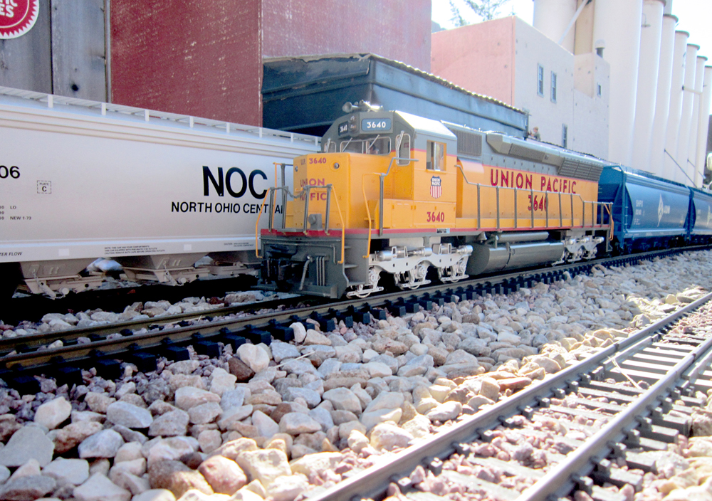 a model train on track on garden railway