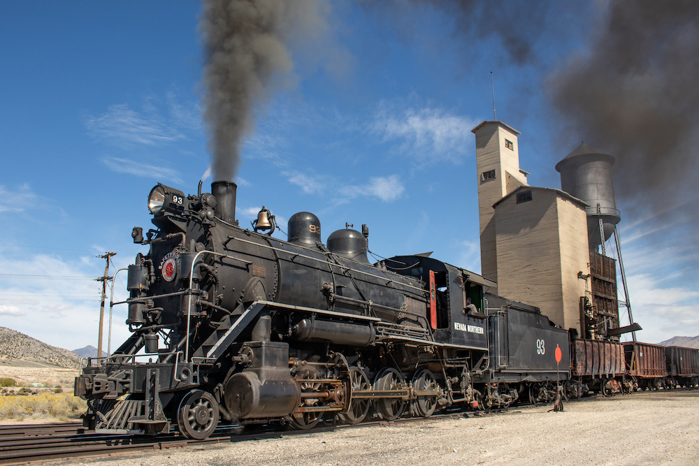 black locomotive No. 93 with gray smoke