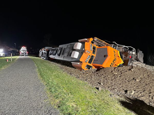 Locomotive on its side at night