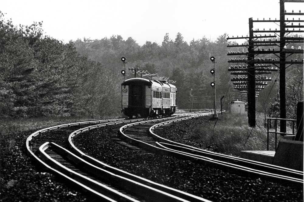 Rear of Penn Central passenger train on curve