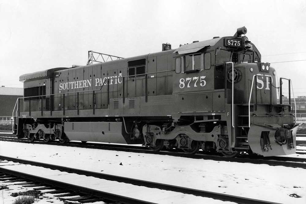 Diesel locomotive in rail yard in snow