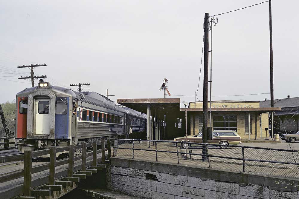 Passenger train outside stone station