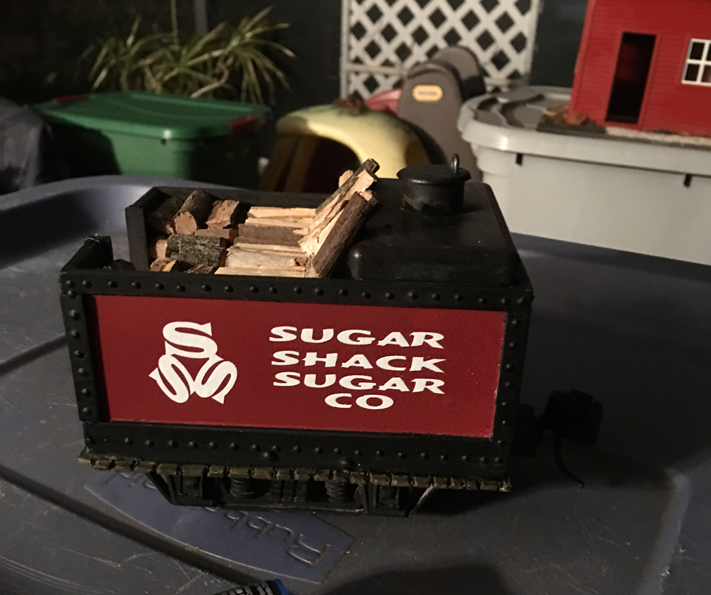 model of a red tender with white lettering