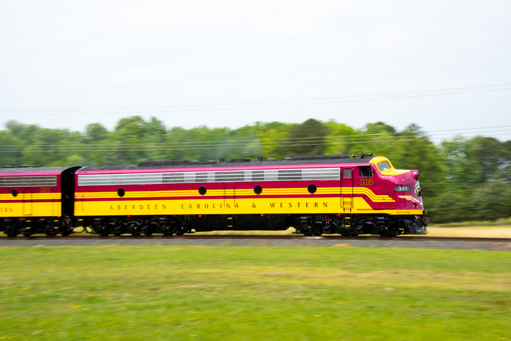 pan photo of red and yellow loco