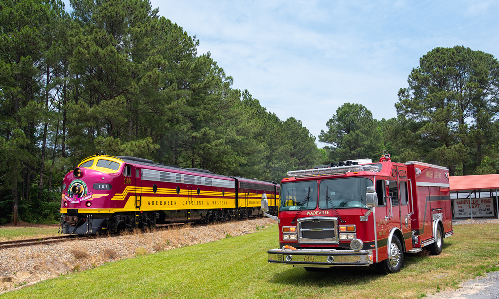red and yellow loco by fire truck