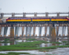 red and yellow loco over dam