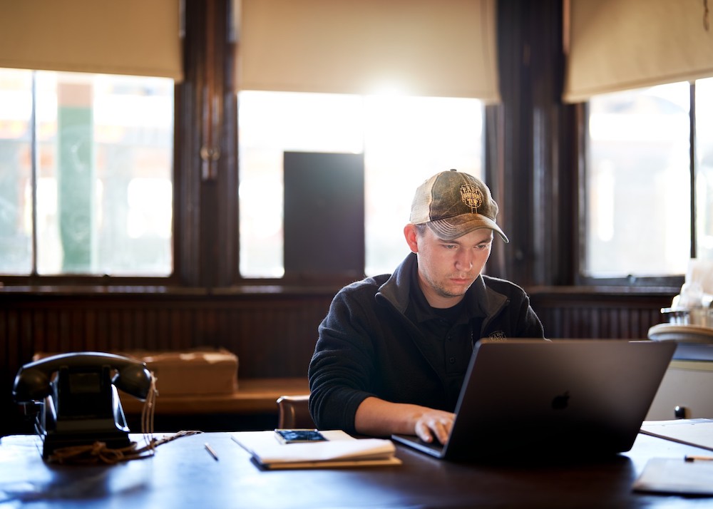 Young individual working at an office.