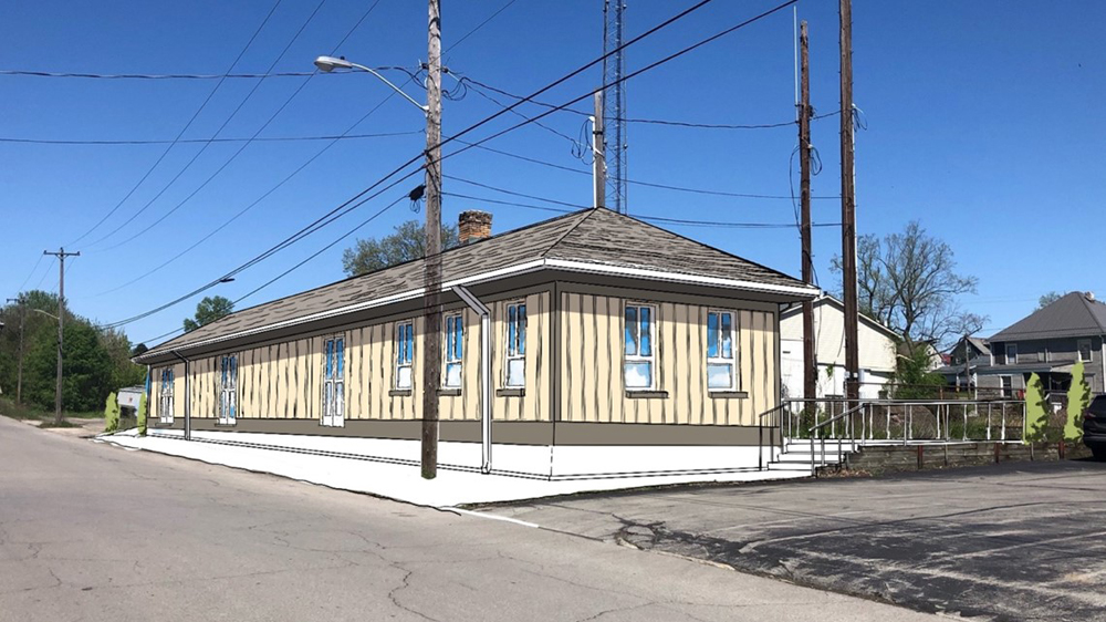 Image of single-story wood-sided train station