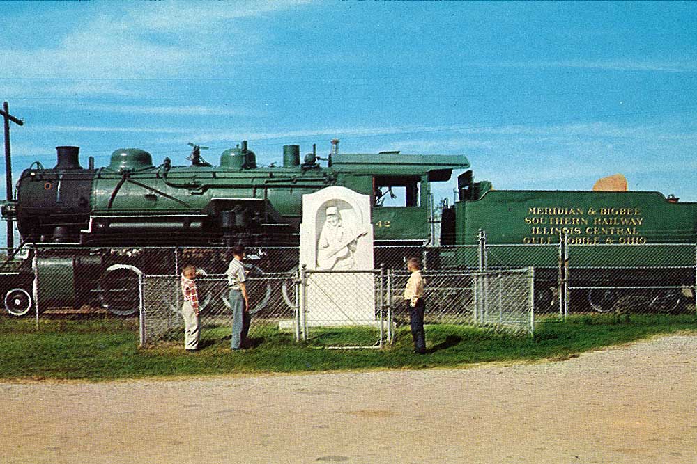 Green Meridian & Bigbee Railroad steam locomotive with statute