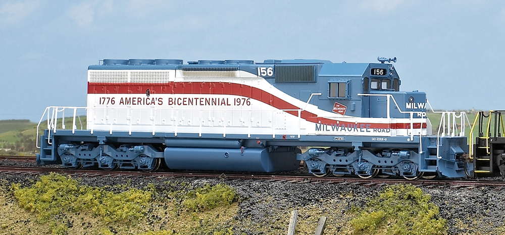 Color image of HO scale six-axle road locomotive on scenic base.