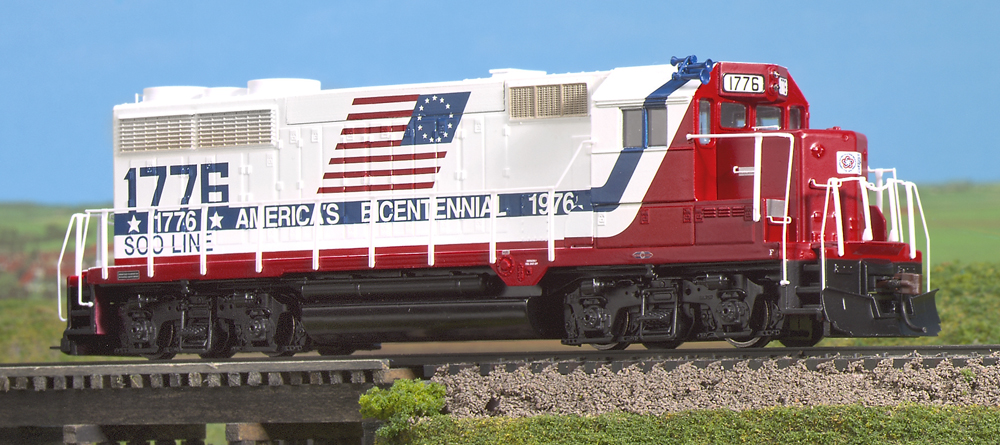 Color photo of HO scale road locomotive on wood trestle.