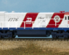 Color photo of N scale diesel locomotive on scenic base.