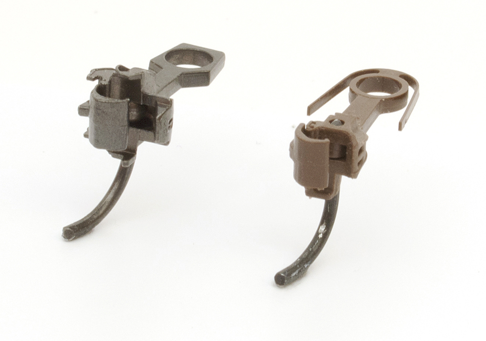 Color photo of HO scale shelf couplers.