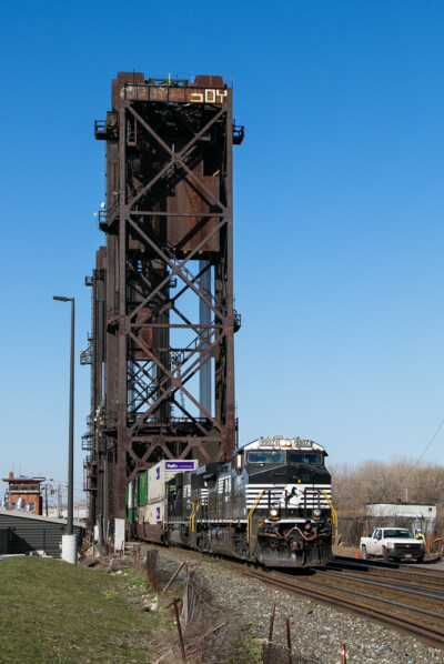 Norfolk Southern train crossing lift bridge. 