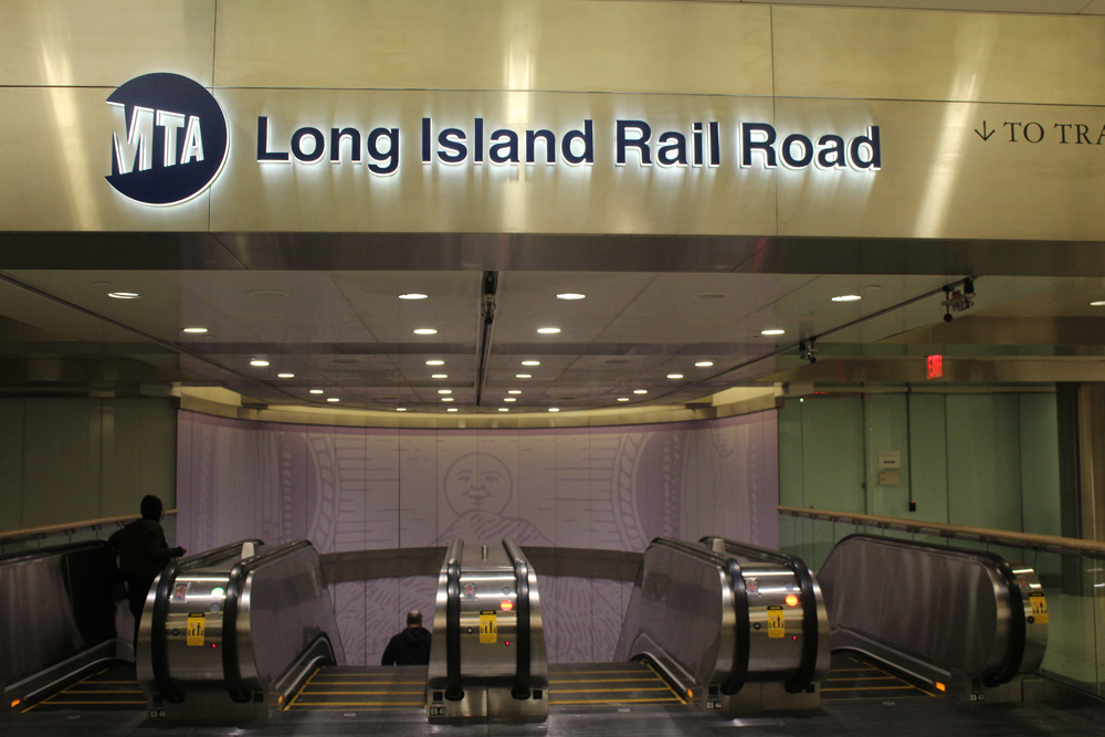 Sign at top of escalators to mezzanine