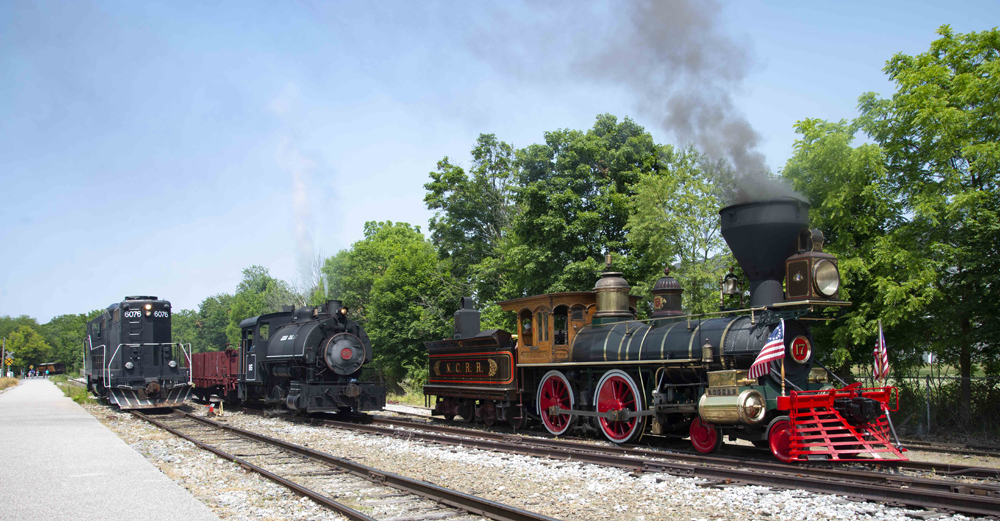 Two steam locomotives and one diesel posed for photos