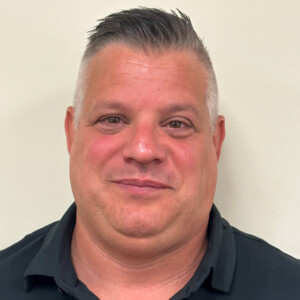 Head shot of man with short hair