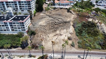 Aerial view of landslide above railroad tracks