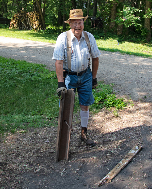 Man holding piece of rail