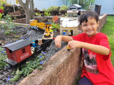 Playmobil and kids in the garden railway