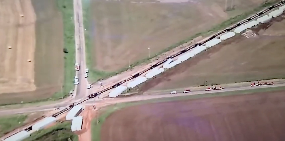 Aerial view of overturned container well cars and containers