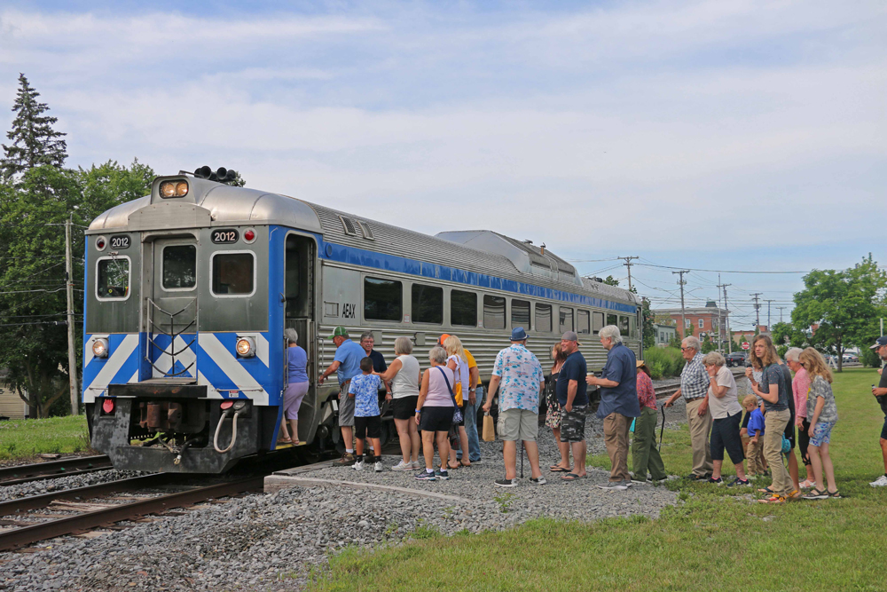 People board Rail Diesel Car