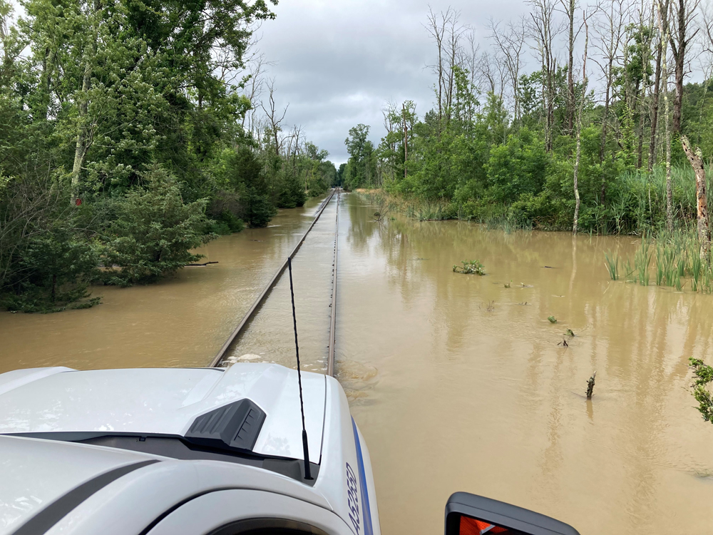 Hi-Rail vehicle on flooded track