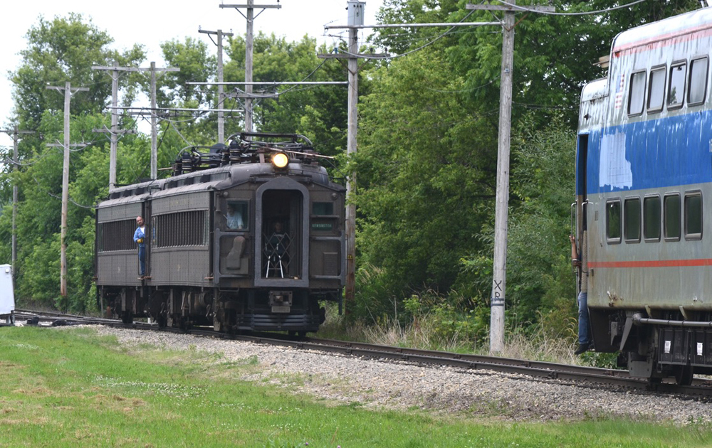 Green 1920s era electric mutliple unit cars follow 1970s era EMUs