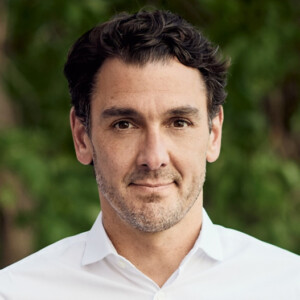 Head shot of man in white shirt