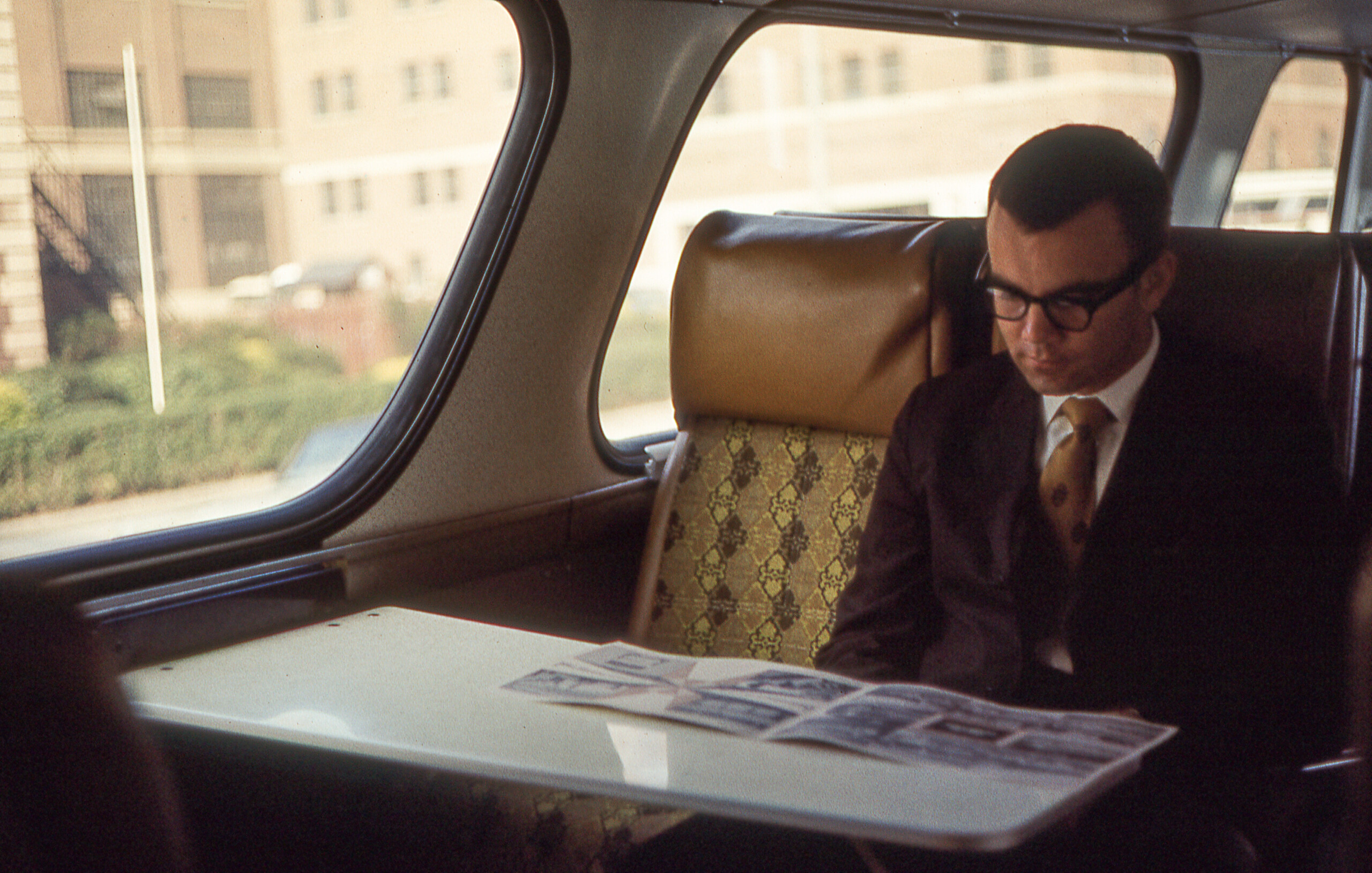 man sitting in passenger train