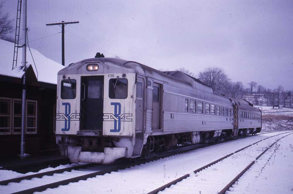 Stainless steel rail passenger cars in snow