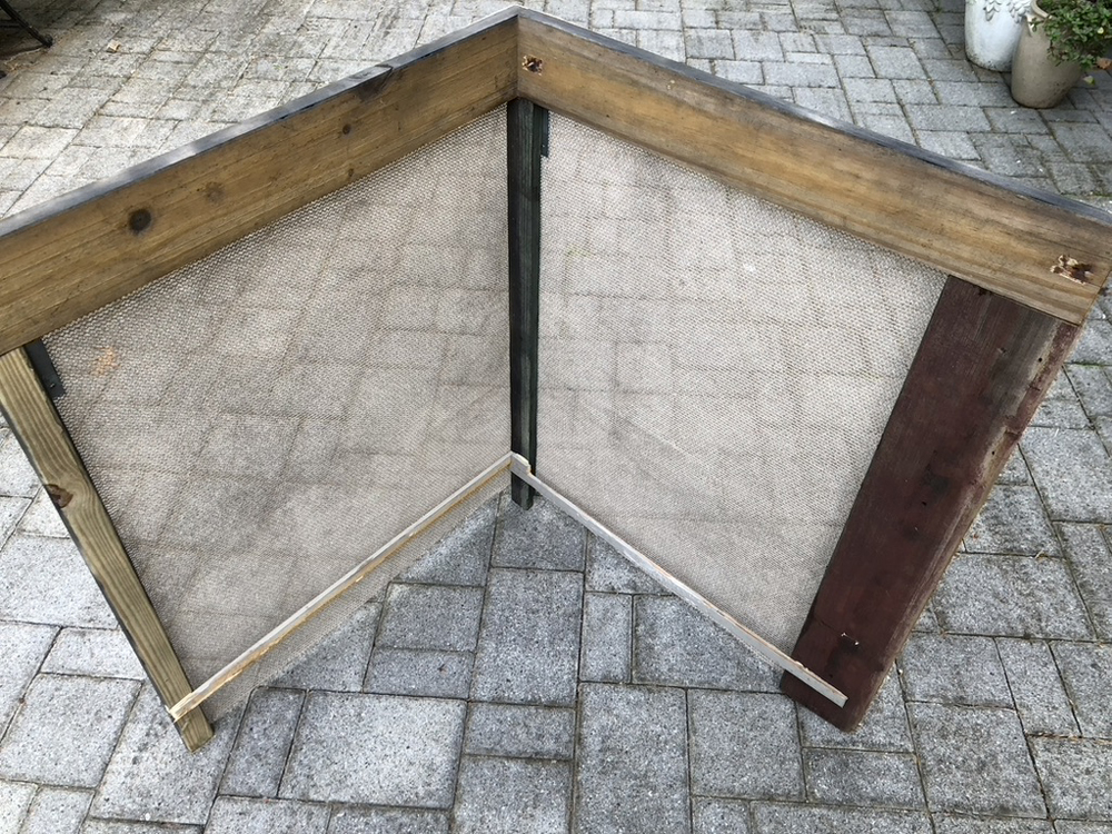 wood frame with mesh stapled onto it