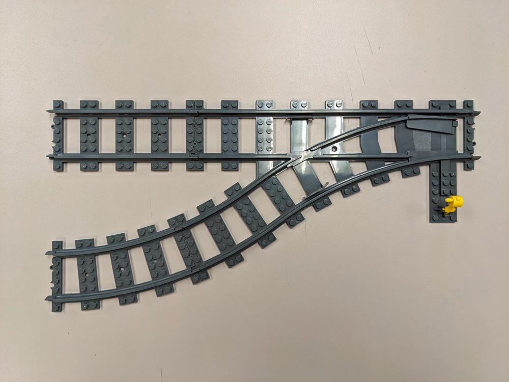 Gray LEGO train track switch