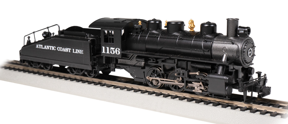 Color photo of compact steam locomotive and tender.