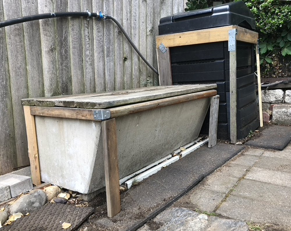 wood frames around compost and storage bin