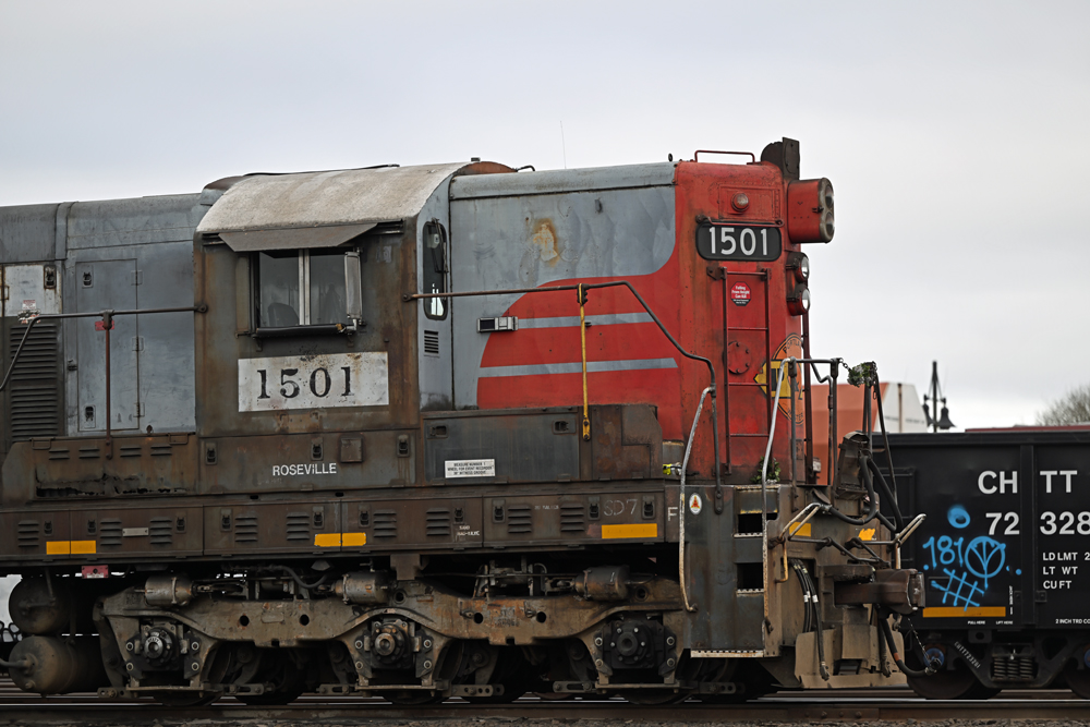 closeup of red and gray locomotive