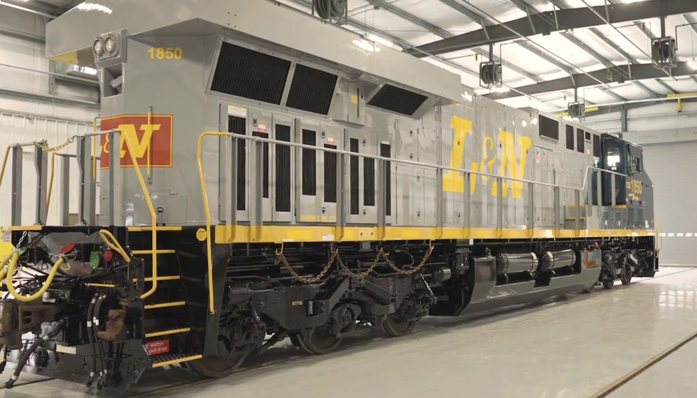 Rear view of blue and gray diesel.