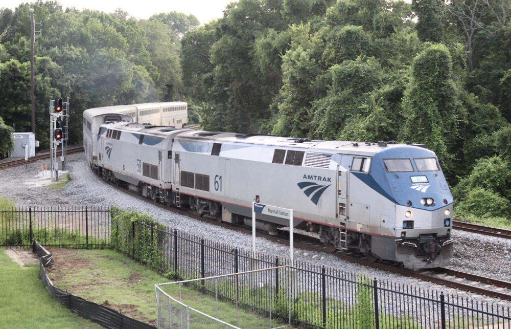 Passenger train with two engines and four cars on curve