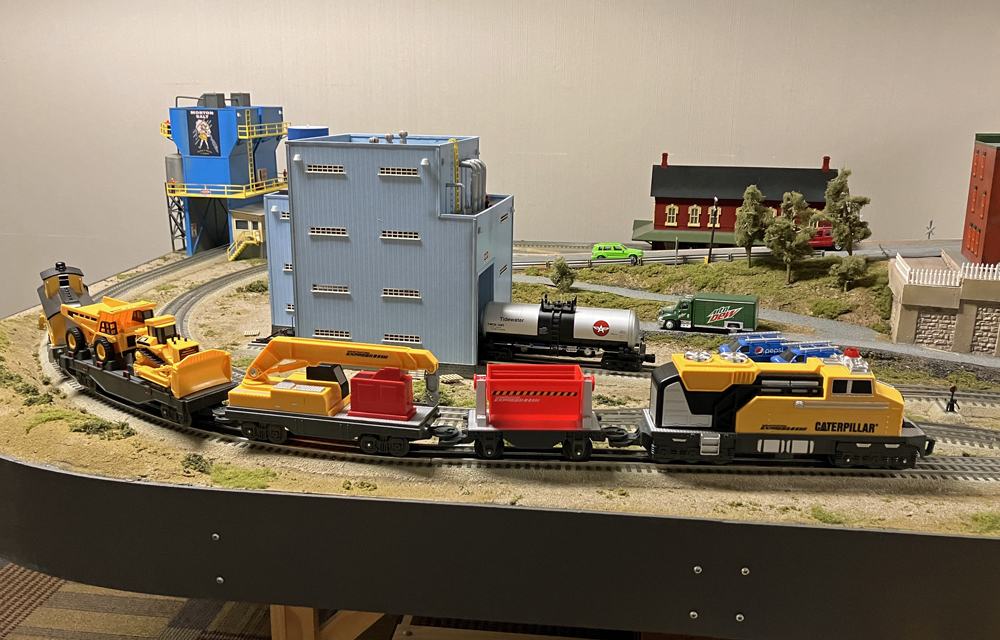 plastic yellow and black locomotive on train layout