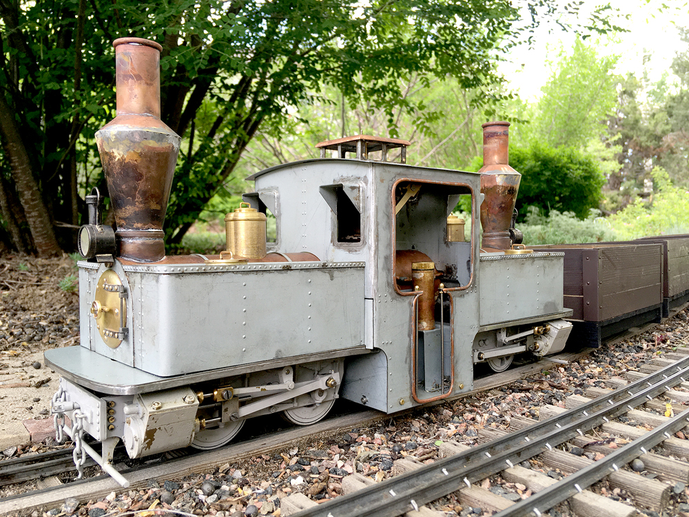unpainted model locomotive on track