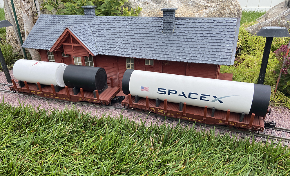 model rocket piece on large-scale flatcar