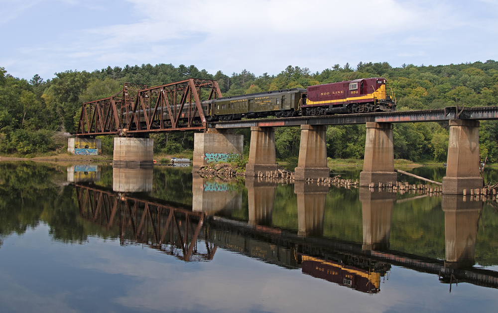 train crossing bridge with water under
