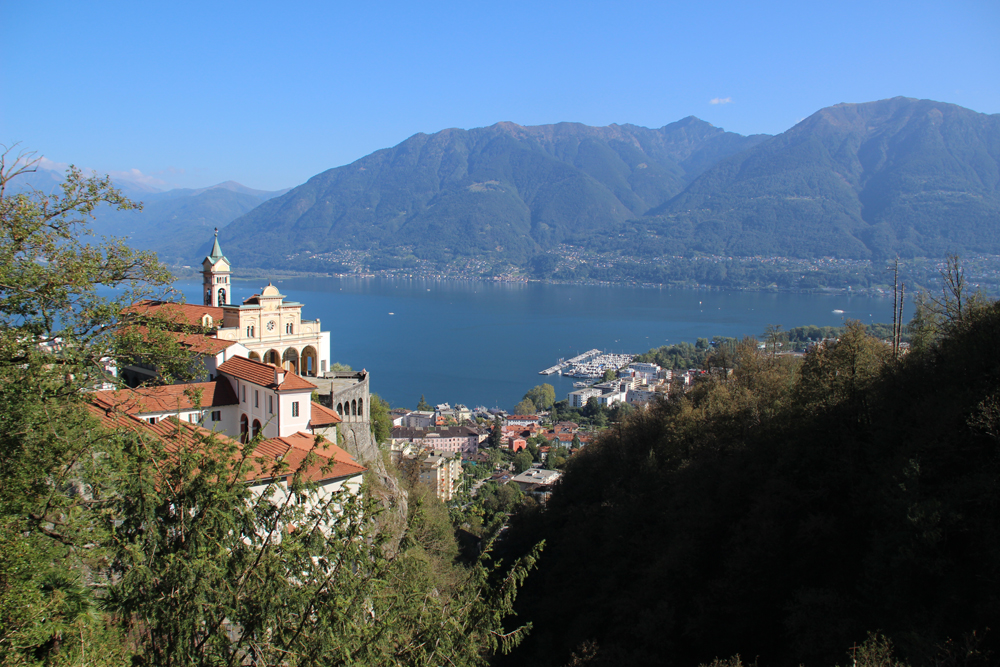Church, town, and lake as seen from top of hill